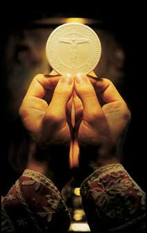 hands holding eucharist.